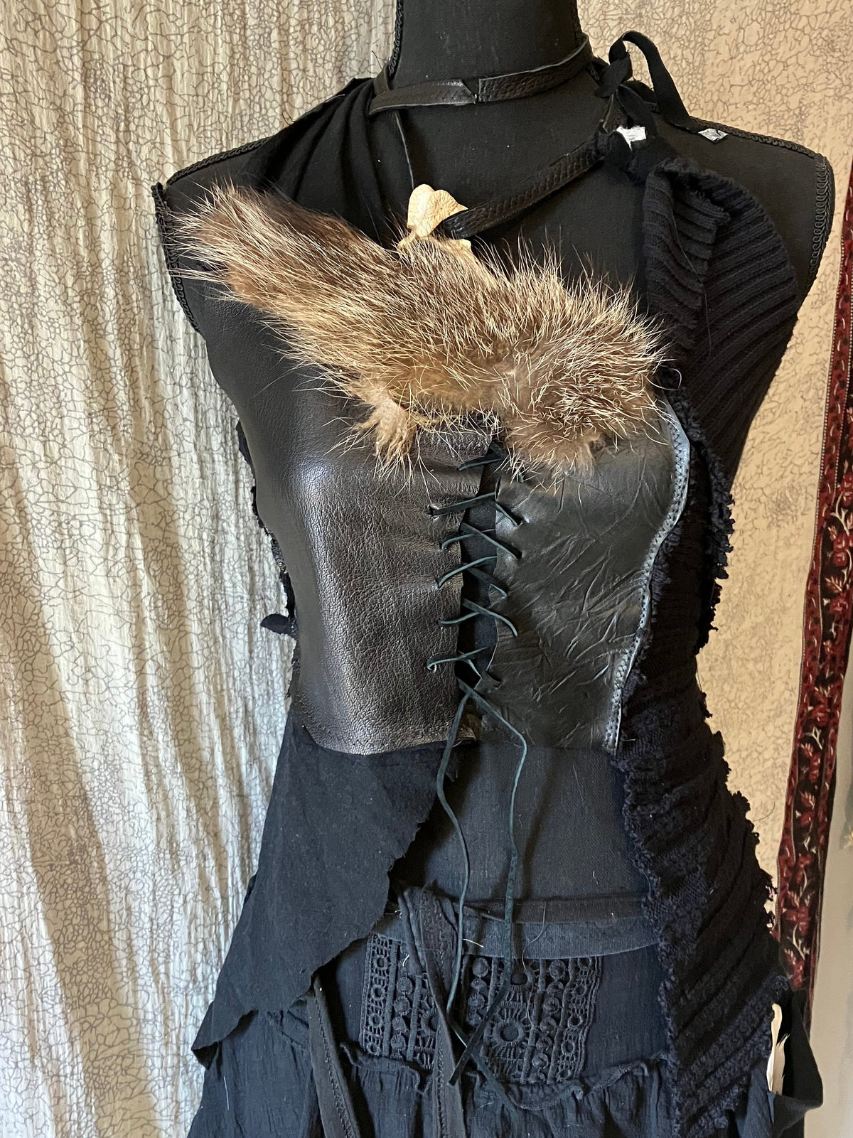 rakoon pelt & raven feathers leather top
