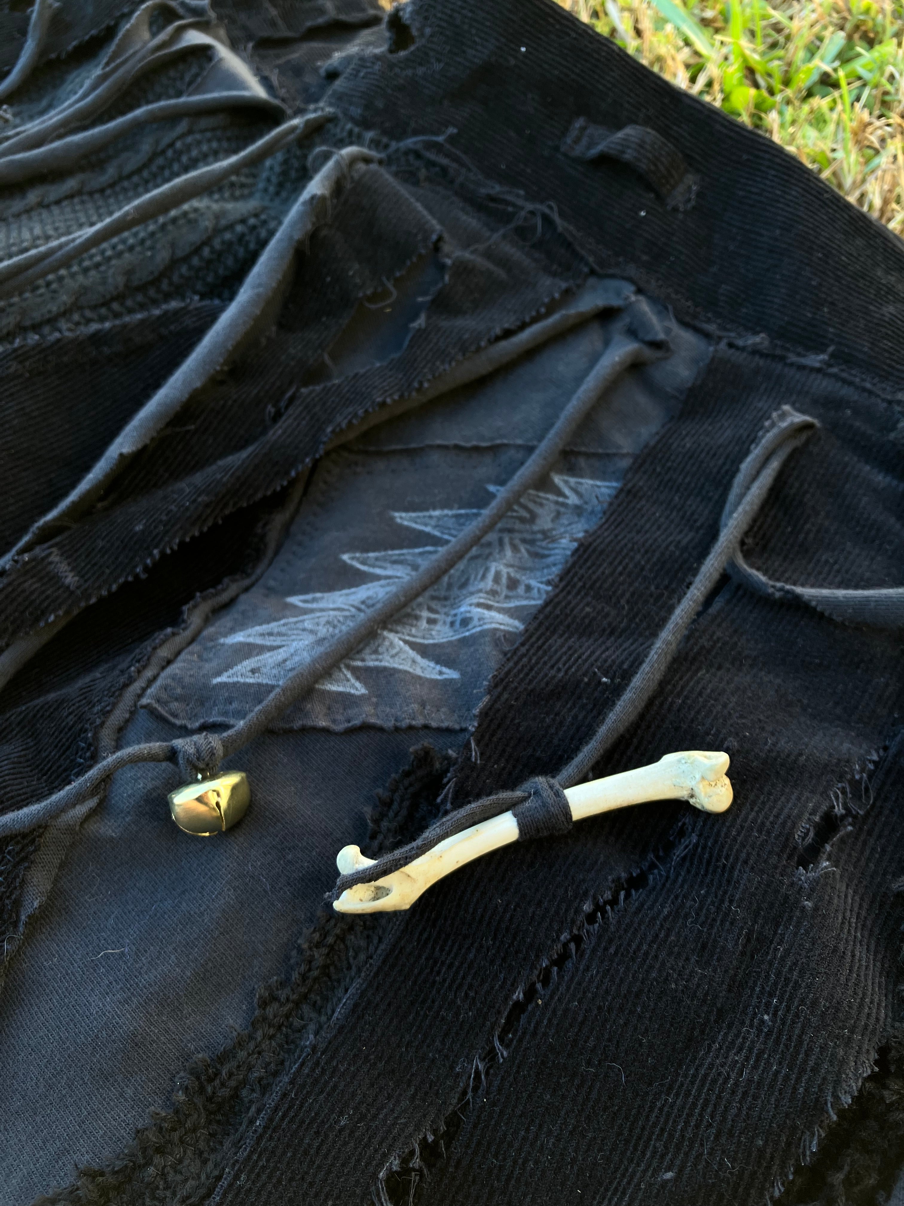 skirt with bones, shells & bells