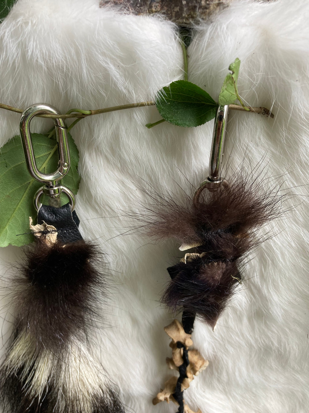 skunk tail & vertebrae keychains