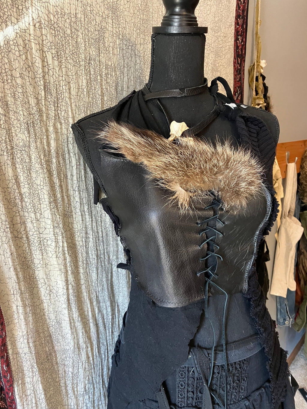 rakoon pelt & raven feathers leather top