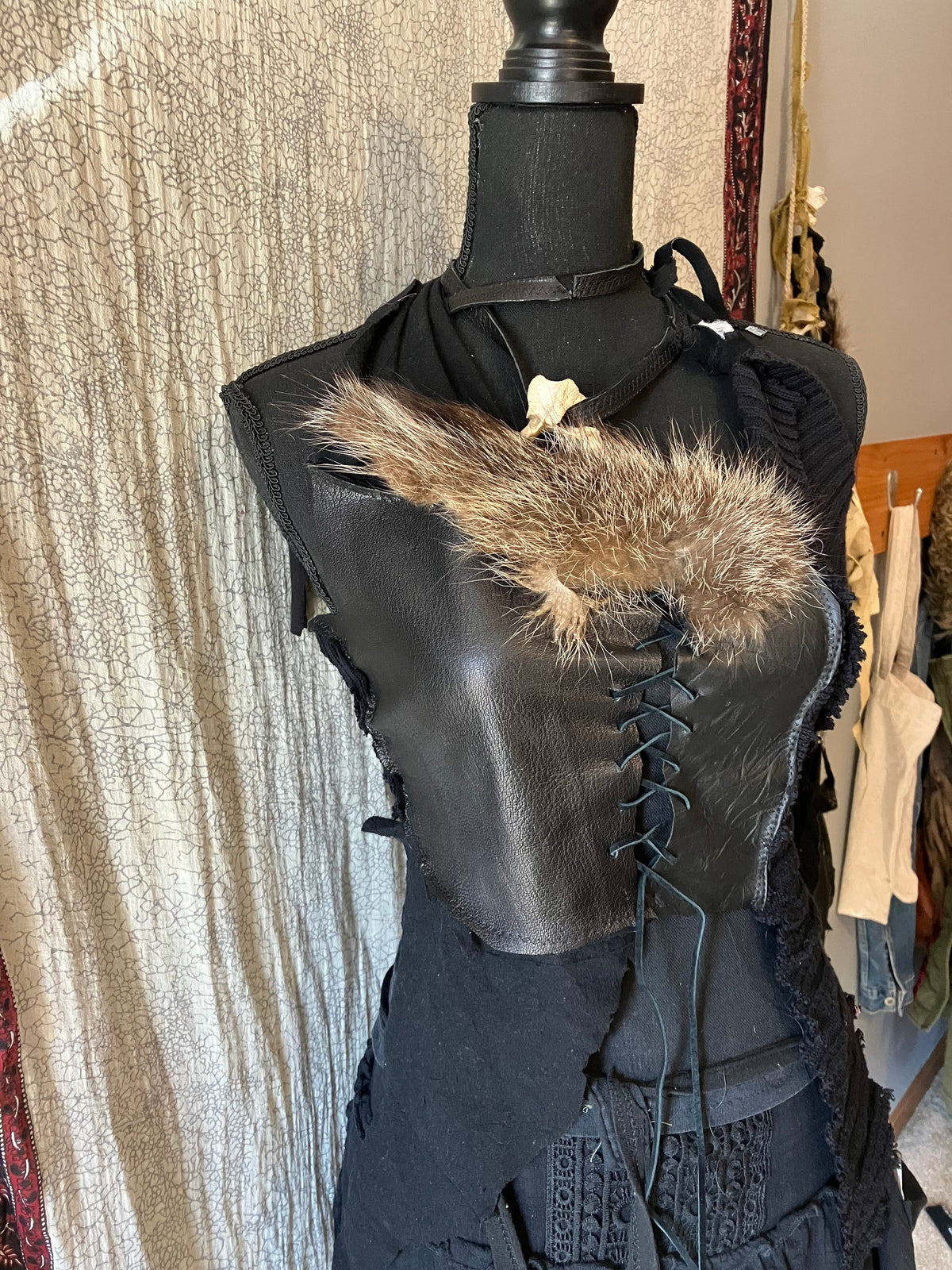 rakoon pelt & raven feathers leather top