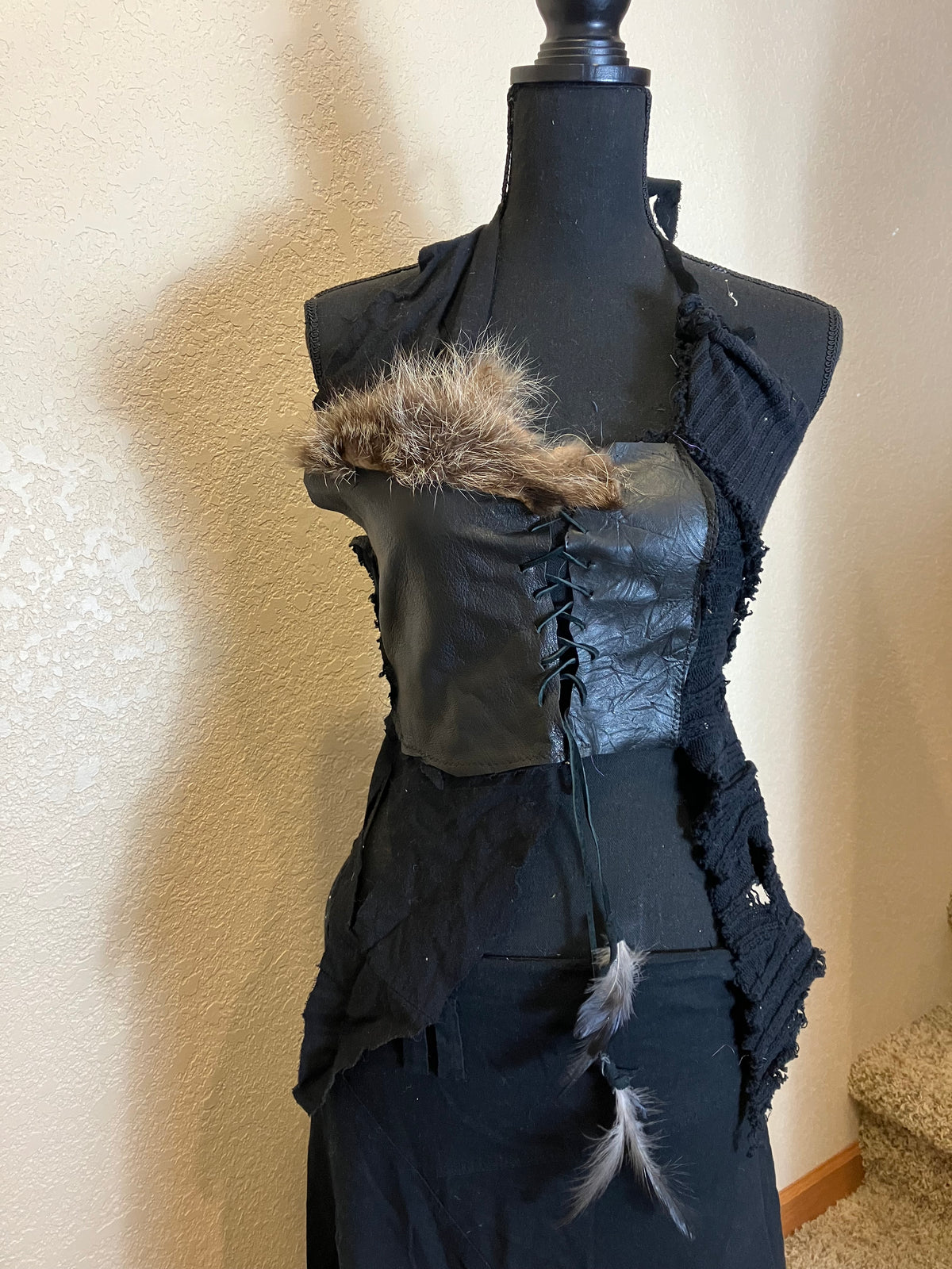 rakoon pelt & raven feathers leather top