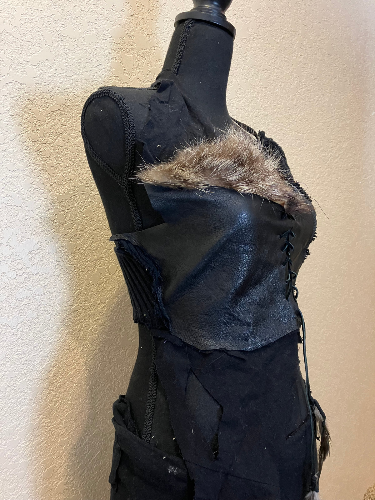 rakoon pelt & raven feathers leather top
