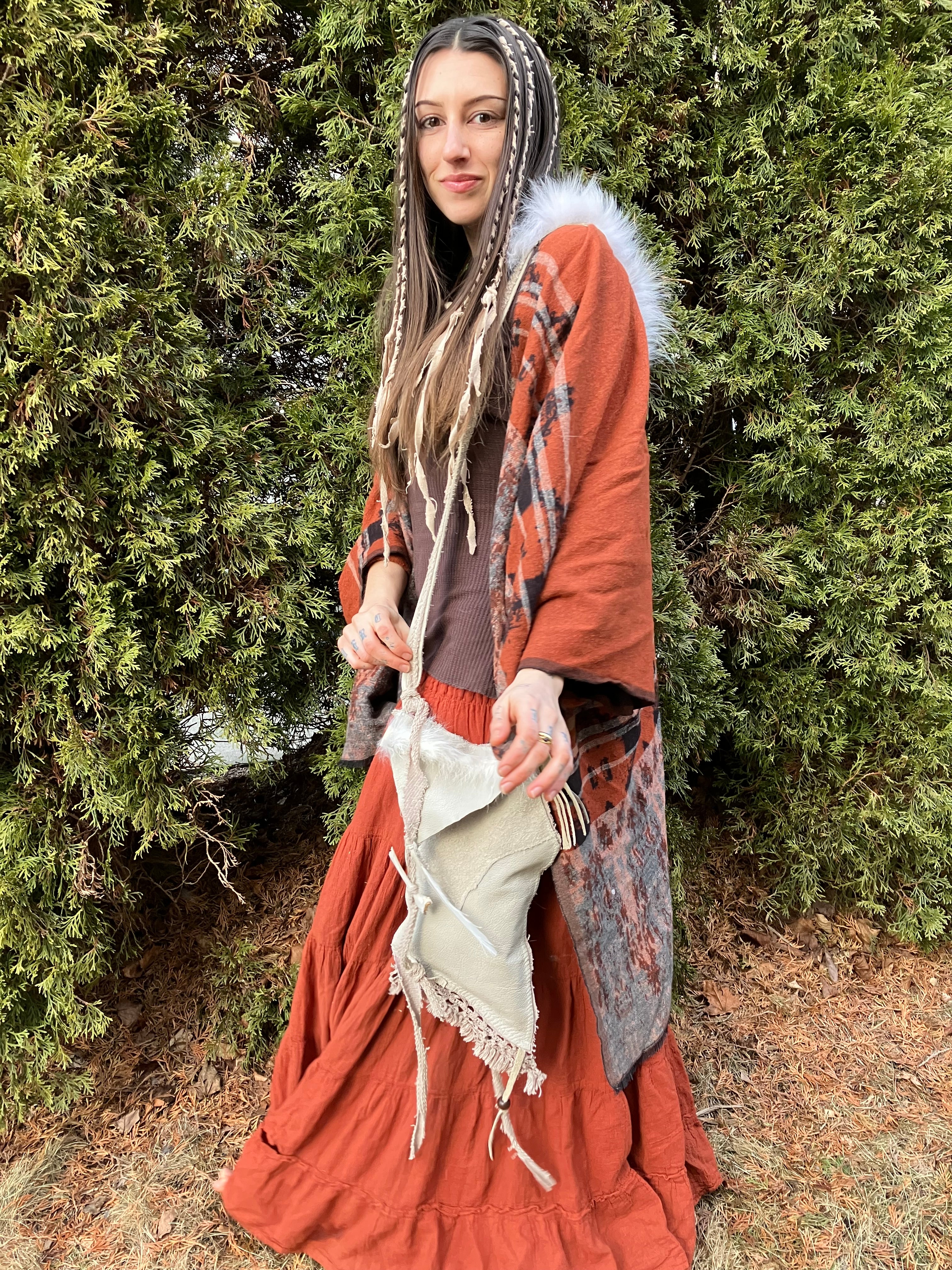 leather purse with cayote fur, feather, bone & cotton details