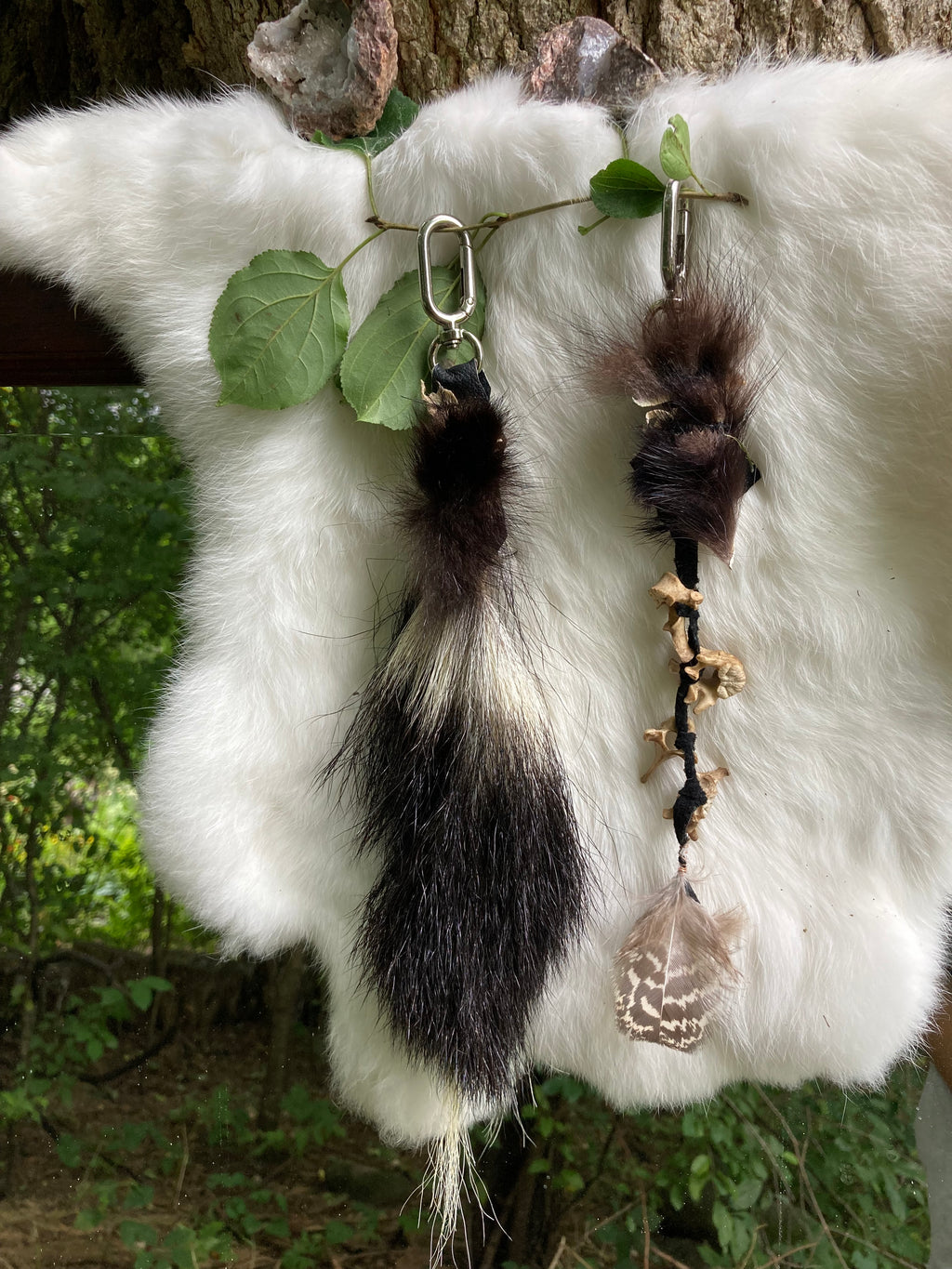 skunk tail & vertebrae keychains